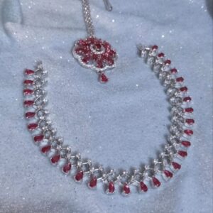 Sleek ad neckpiece with tika and hoop style jhumkas